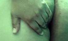 my busty stepmother fingers herself while bathing, looking so hot and tempting