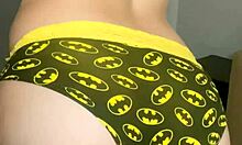 close-up faceless young babe trying on panties from mv store in gym