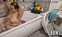 Pervert spies on BBW washing her giant floppy tits in the bath