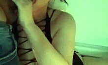 In the bath, the girl uses a dildo and a sock as a makeshift cock for a homemade blowjob.