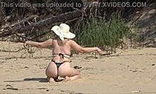 milf relaxes solo on the beach