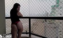 housewife enjoying outdoor activity on balcony