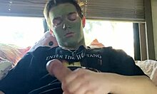 Fit guy strokes his cock during skin care routine
