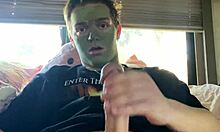 Fit guy strokes his cock during skin care routine