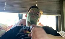 Fit guy strokes his cock during skin care routine