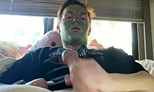 Fit guy strokes his cock during skin care routine