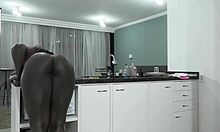 Athletic black pornstar in lingerie teases young toy in kitchen