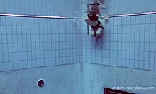 Underwater babe roxalana cheh bathes naked in the pool