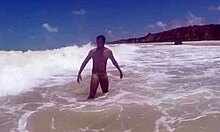 Muscular guy shaking his ass at the beach in tambaba