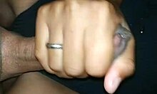 my girlfriend gives a handjob to my friend, leading to a cumshot in this casual homemade video.