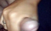 my girlfriend gives a handjob to my friend, leading to a cumshot in this casual homemade video.
