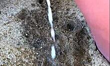 my african wife takes a long pee on the beach, amateur footage