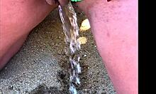 my african wife takes a long pee on the beach, amateur footage