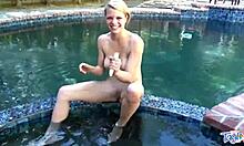 Hey there, watch this blonde teen play with toys in outdoor pool