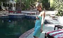 Hey there, watch this blonde teen play with toys in outdoor pool