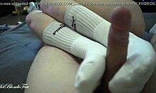 miley grey gives me a sexy footjob with her long socks on, rubbin my monster cock