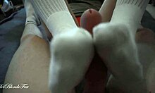 miley grey gives me a sexy footjob with her long socks on, rubbin my monster cock