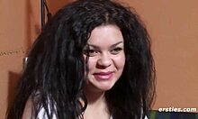 German-Brazilian babe masturbates wetly in front of camera, showing natural tits and feet.