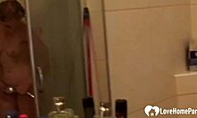 Can you believe this beautiful blonde is pleasuring herself in the shower so quietly?