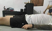 Latina teen enters room and interacts with resting person