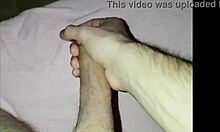 A young guy at home strokes his cock solo, building up to a big release.