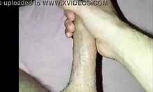 A young guy at home strokes his cock solo, building up to a big release.