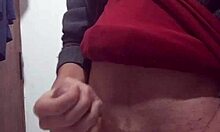 skinny amateur jerks off with clothes on in solo masturbation