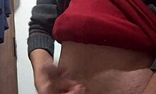 skinny amateur jerks off with clothes on in solo masturbation