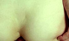 hot brunette rides and receives a creampie in her tight ass during close-up action.