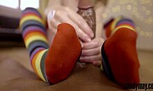 Candy May teases big black cock with handjob and rainbow socks