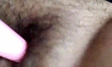 Brunette masturbates her hairy pussy.