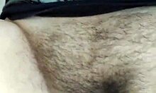 Brunette masturbates her hairy pussy.