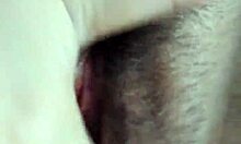 Brunette masturbates her hairy pussy.