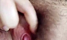 Brunette masturbates her hairy pussy.