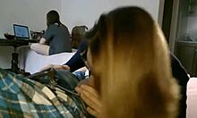 The student was playing on the computer while her friend secretly sucked her boyfriend's cock.