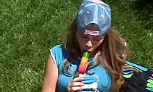 Hey, watch teen Little April rub clit outdoors with popsicle!