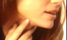 redhead latina in vintage lingerie shows off sexy curves.