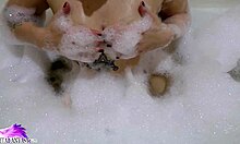 i watch this cute babe sloppily suckin' a huge dildo in the bath with foam