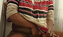 Ebony milf feels intense pleasure masturbating with toys in her wet clothed shower.