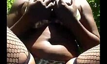 why is this masked ebony whore masturbating outdoors in lingerie?