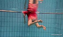 Yo, check Duna Bultihalo’s big tits underwater in that red dress! 😍