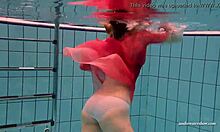 Yo, check Duna Bultihalo’s big tits underwater in that red dress! 😍