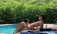 Natasha and Megan tan naked while the lucky guy cleans pool.