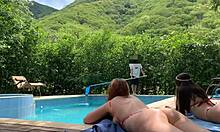 Natasha and Megan tan naked while the lucky guy cleans pool.