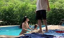 Natasha and Megan tan naked while the lucky guy cleans pool.