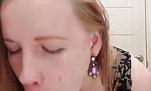 Milf in dress sucks dildo and caresses wet pussy in the restroom