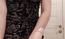 Milf in dress sucks dildo and caresses wet pussy in the restroom