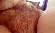 Rubbing her hairy MILF pussy feels so damn good