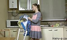 young russian wife teases with hairy pussy while solo in kitchen