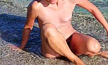 Natural girl flaunts assets at nudist public beach voyeur spot